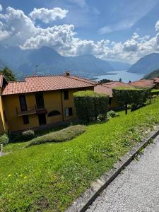 a house on a hill with a green yard at Bellagio, Grigna & Lake Suite in Civenna