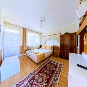 Postel nebo postele na pokoji v ubytování Kervansaray Hotel