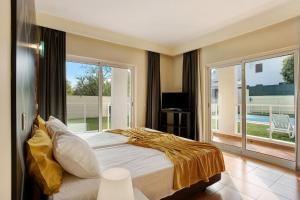 Ένα ή περισσότερα κρεβάτια σε δωμάτιο στο SunHome - Casas de férias em Portimao +45 φωτογραφίες