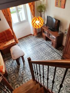 TV a/nebo společenská místnost v ubytování Gite Le jardin de Céline