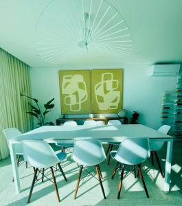a dining room with a table and chairs at Lux Hiato's Villa in Luz de Tavira