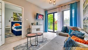 Posedenie v ubytovaní Apartament Szmaragdowy w Karpatia - 5D Apartamenty