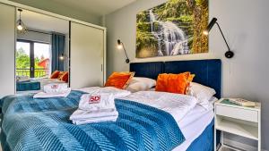 Posteľ alebo postele v izbe v ubytovaní Apartament Szmaragdowy w Karpatia - 5D Apartamenty