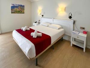 Voodi või voodid majutusasutuse Hotel Pere D'Urg 3000 toas