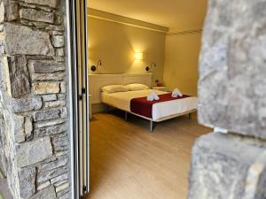 Voodi või voodid majutusasutuse Hotel Pere D'Urg 3000 toas