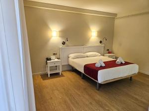 Voodi või voodid majutusasutuse Hotel Pere D'Urg 3000 toas