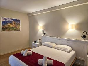 Voodi või voodid majutusasutuse Hotel Pere D'Urg 3000 toas