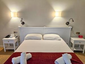 Voodi või voodid majutusasutuse Hotel Pere D'Urg 3000 toas
