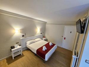 Voodi või voodid majutusasutuse Hotel Pere D'Urg 3000 toas