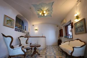 A seating area at Hotel Residence - Parco Mare Monte