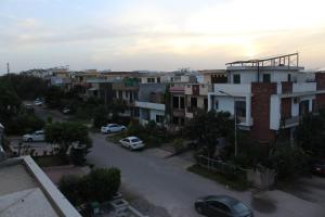 a view of a city street with houses and cars at Regal Horizon G-13 in Islamabad