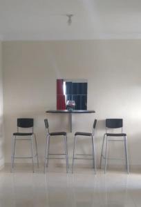 a group of four chairs in a room at Hermoso Apartamento Turístico in Colorado