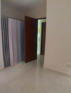 a room with two sliding doors and a mirror at Hermoso Apartamento Turístico in Colorado