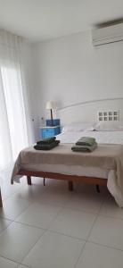 A bed or beds in a room at casa santa caterina