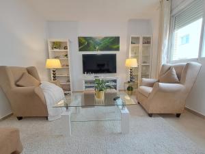 Televízia a/alebo spoločenská miestnosť v ubytovaní Apartamento Romero valencia