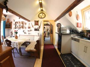 a kitchen with a table and a dining room at Landgasthof und Landhaus Hofmeister in Diemelsee