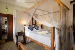Postel nebo postele na pokoji v ubytování Zenji Hotel