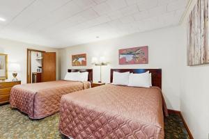 Ένα ή περισσότερα κρεβάτια σε δωμάτιο στο Riverbank Connecting Motel Rooms 4 & 6 +26 φωτογραφίες