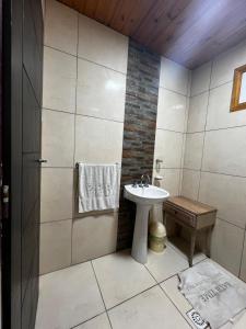 a small bathroom with a sink and a shower at Tu hogar para vacacionar in Mar del Plata