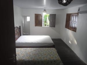 Postel nebo postele na pokoji v ubytování Casa de praia Milton JR + 43 fotografií