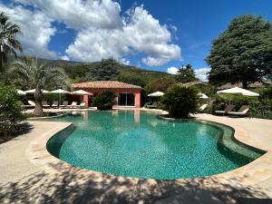 a swimming pool in the middle of a yard at Domaine De Respelido in Carros +16 photos