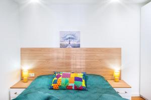 Ένα ή περισσότερα κρεβάτια σε δωμάτιο στο HB apartments Irakli Abashidze +20 φωτογραφίες