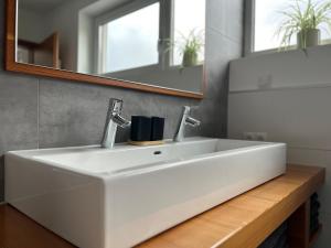 Koupelna v ubytování Haus Dahuam + 26 fotografií
