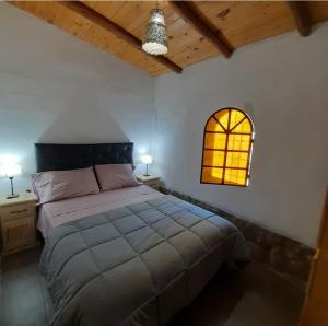 Postel nebo postele na pokoji v ubytování ENRAMADA Hospedaje en San Marcos Sierras + 41 fotografií