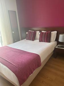 Postel nebo postele na pokoji v ubytování Hotel Coroa de Fátima