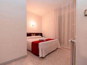 Voodi või voodid majutusasutuse Hotel Pere D'Urg 3000 toas