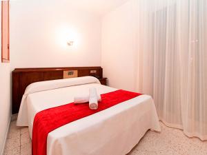 Voodi või voodid majutusasutuse Hotel Pere D'Urg 3000 toas