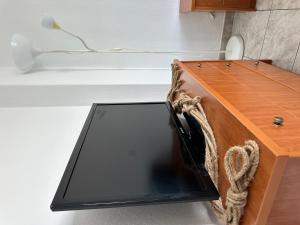 a desk with a laptop on top of it at Near Sea Studio in Paralia Katerinis