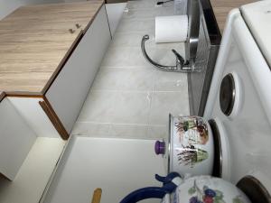 an overhead view of a bathroom with a sink and a toilet at Near Sea Studio in Paralia Katerinis +5 photos