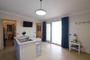 a kitchen with a sink and a counter top at Mediterranean View in Marina di Ragusa