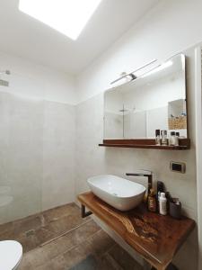 a bathroom with a white sink and a mirror at Casa Luciana in Chiaverano +44 photos