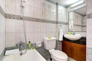 a bathroom with a toilet and a sink at Villa Heracles by Villa Plus in Peyia +15 photos