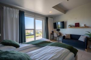 Postel nebo postele na pokoji v ubytování Hotel Laki