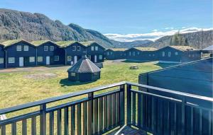 a balcony of a house with mountains in the background at Wonderful cabin in Sirdal in Haugen