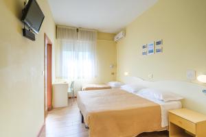 Postel nebo postele na pokoji v ubytování Only Room Hotel