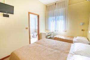 Postel nebo postele na pokoji v ubytování Only Room Hotel