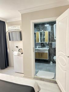 a room with a bathroom with a sink and a toilet at Upart Flats by REFE in Antalya +85 photos