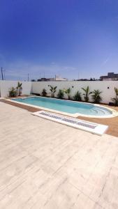 Bazén v ubytování Appartement cosy avec accès piscine nebo v jeho okolí