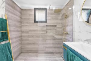a bathroom with a shower and a sink at Casa da Guida in Machico +30 photos