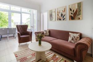 a living room with a couch and a table at Kaya Apart Datca in Datca