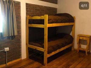 Ένα ή περισσότερα κρεβάτια σε δωμάτιο στο Cabaña Trabun Lago Puelo