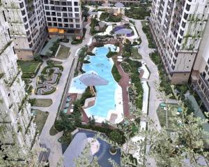 an aerial view of a resort with a swimming pool at Căn hộ 1PN VIEW HỒ BƠI CAO CẤP, FREE POOL, GYM in Gò Công