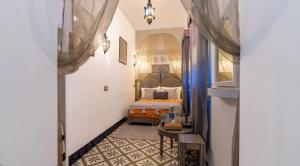Postel nebo postele na pokoji v ubytování Riad 4 Jardins & Spa
