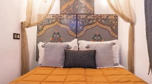 Postel nebo postele na pokoji v ubytování Riad 4 Jardins & Spa