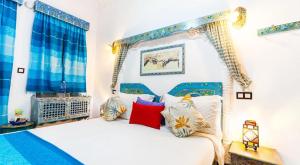 Postel nebo postele na pokoji v ubytování Riad 4 Jardins & Spa