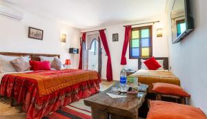 Postel nebo postele na pokoji v ubytování Riad 4 Jardins & Spa